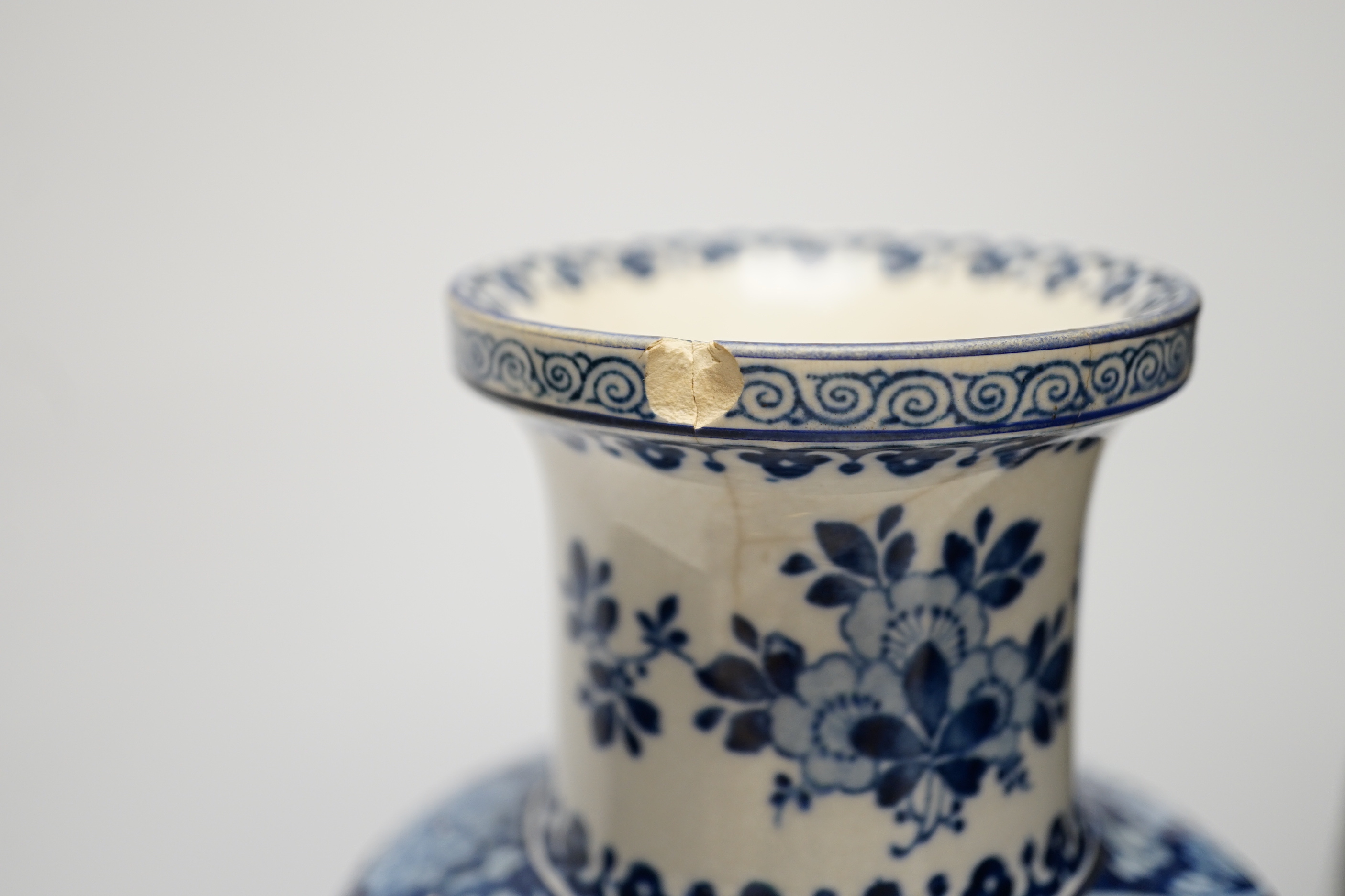 Eight porcelain items; a late 18th century Derby plate with painted scene of Coniston Lake, Lancashire, two floral painted Paris porcelain plates, a pair of Booths blue and white vases, a lidded vase, a Copeland blue gro